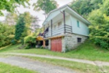 Prodej chaty v Komorní Lhotce na polosamotě se zahradou  207 m2