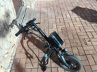 Přídavný elektrický pohon k invalidnímu